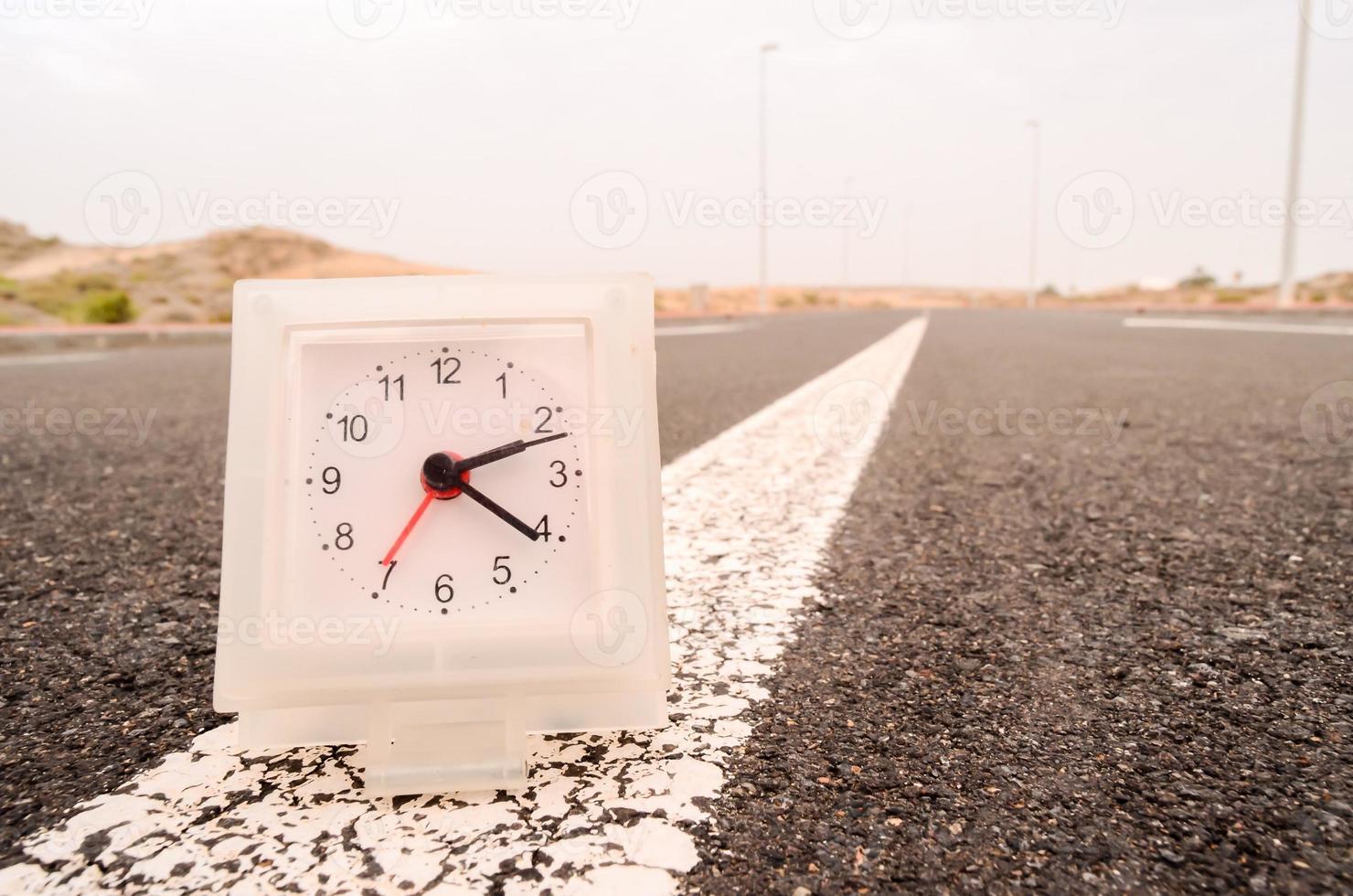 White clock on the road photo