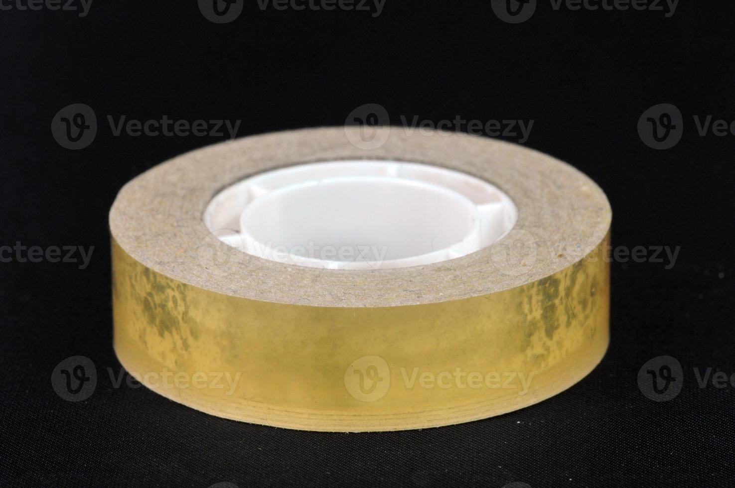 Adhesive tape on black background photo