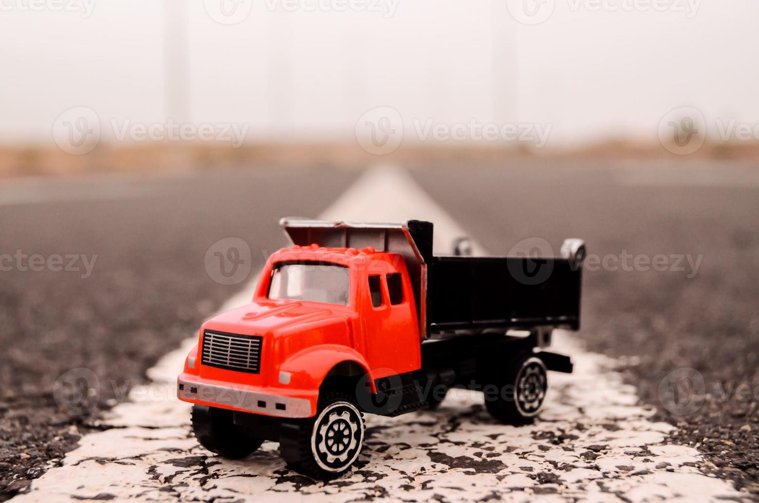 Toy truck on the road photo