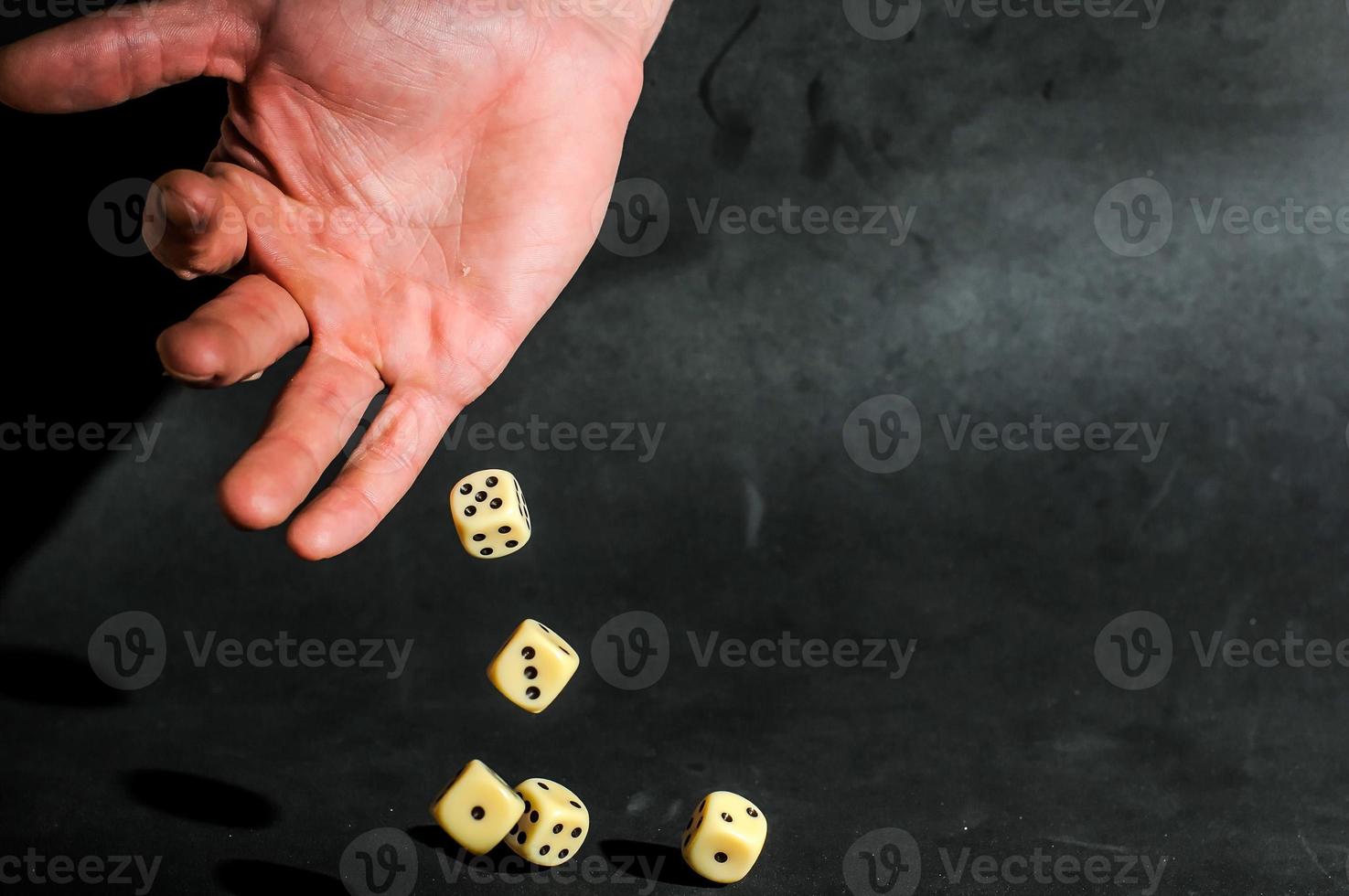 Hand throwing dices photo