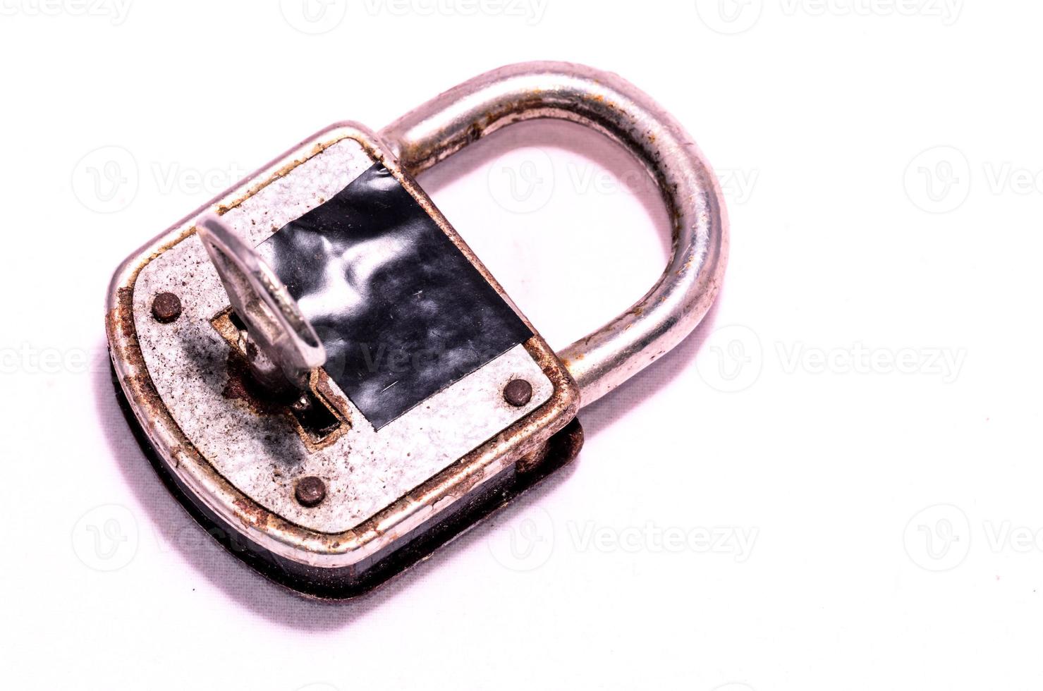 Silver lock on white background photo