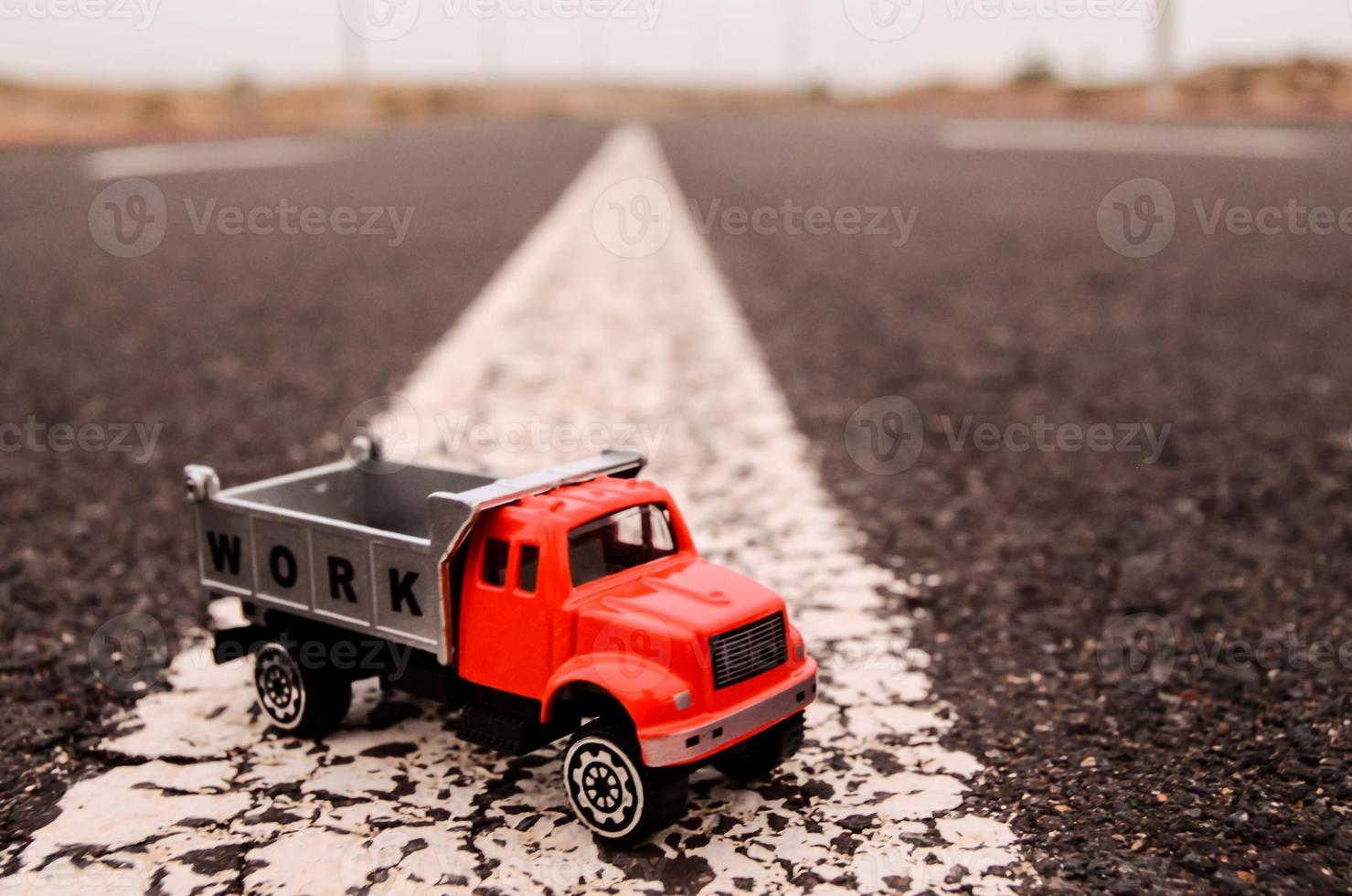 Toy truck on the road photo