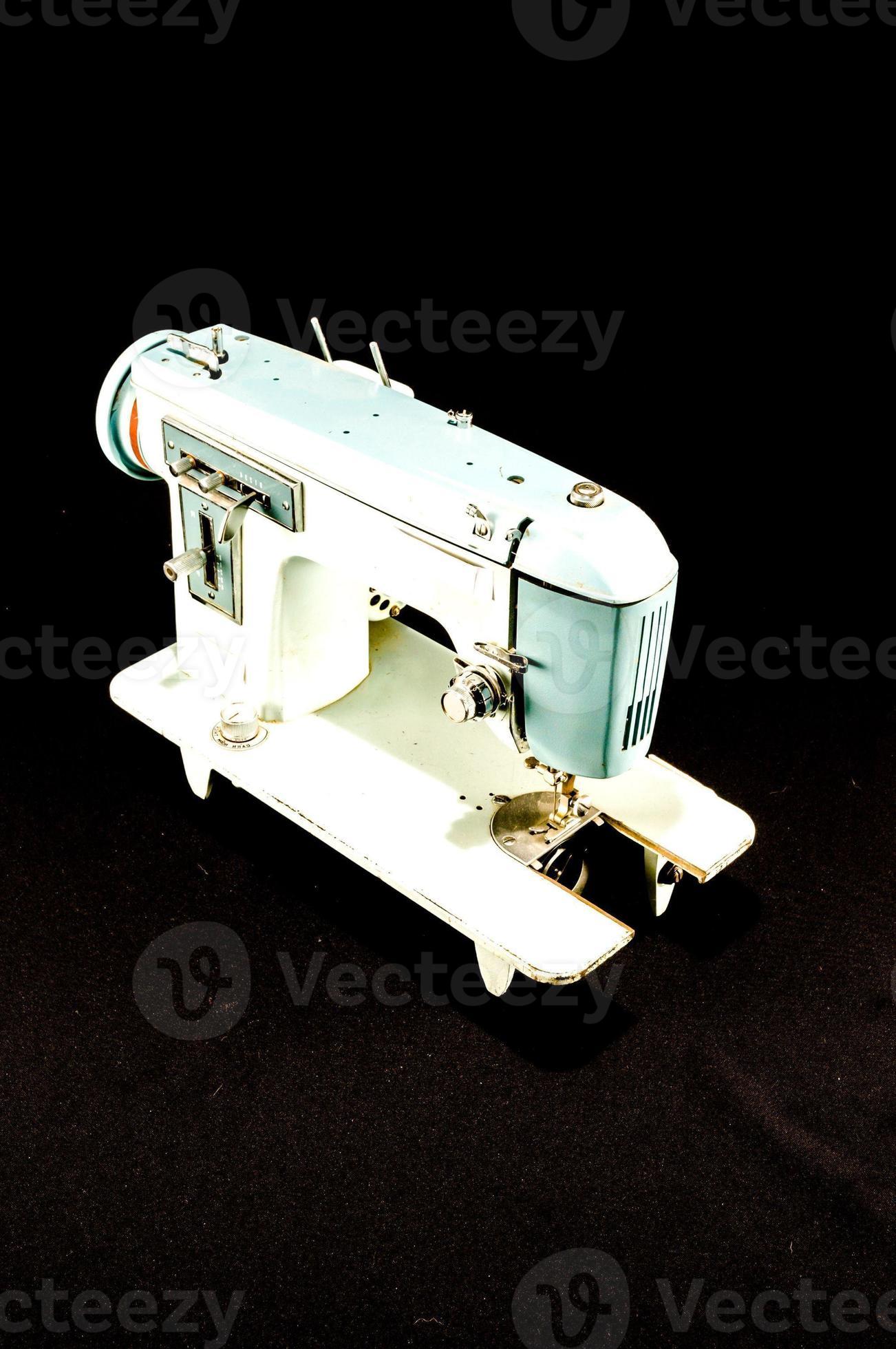 Sewing machine on black background 19913815 Stock Photo at Vecteezy