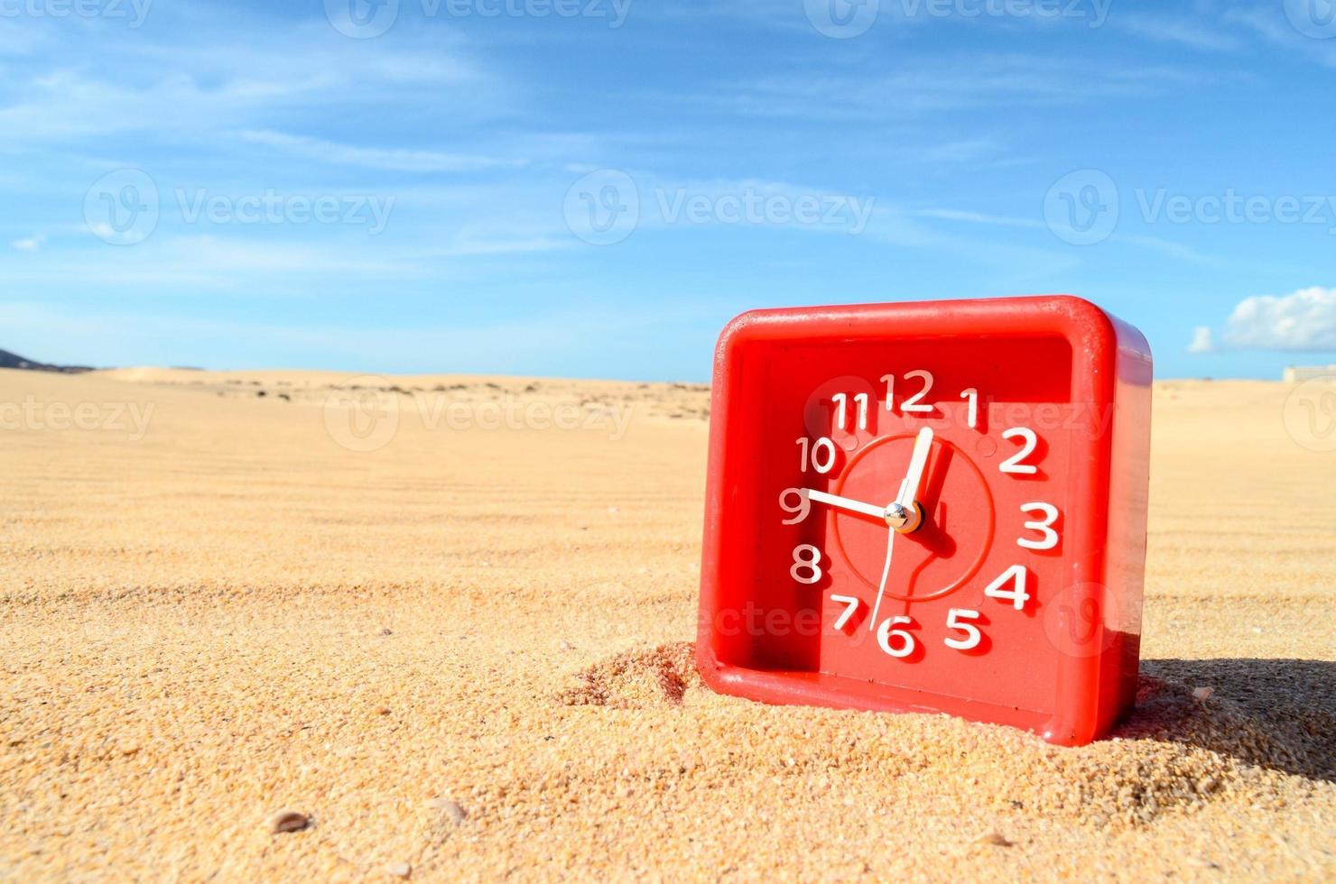 Clock in the sand photo