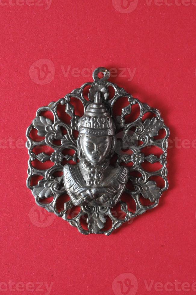 Pendant on pink background photo