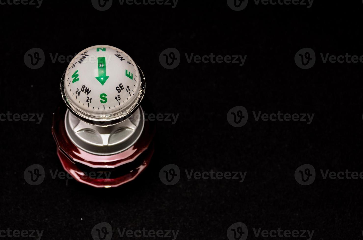 Compass on black background photo