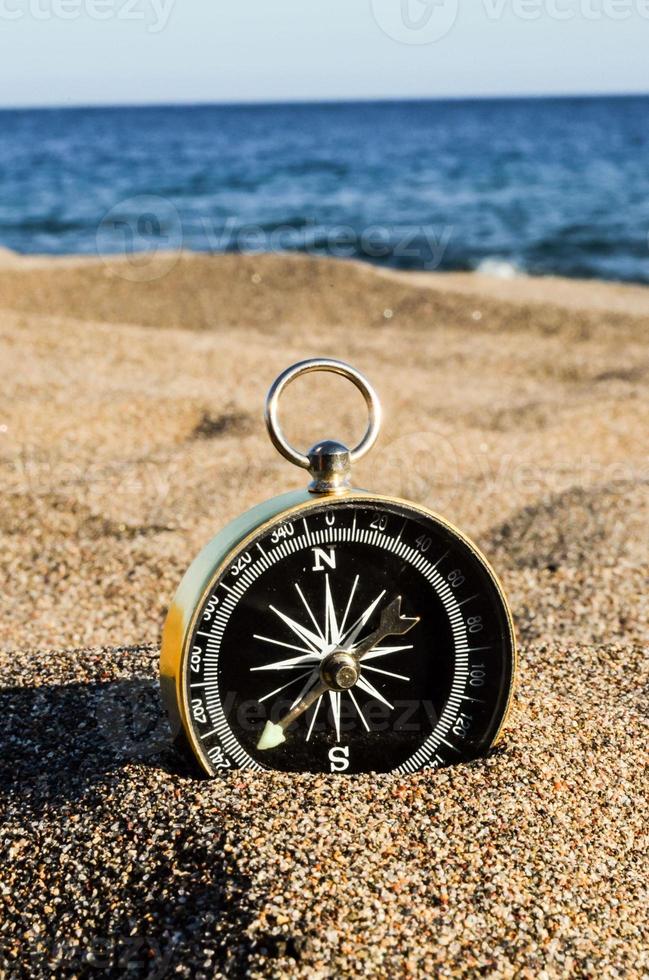 Compass on the sand photo