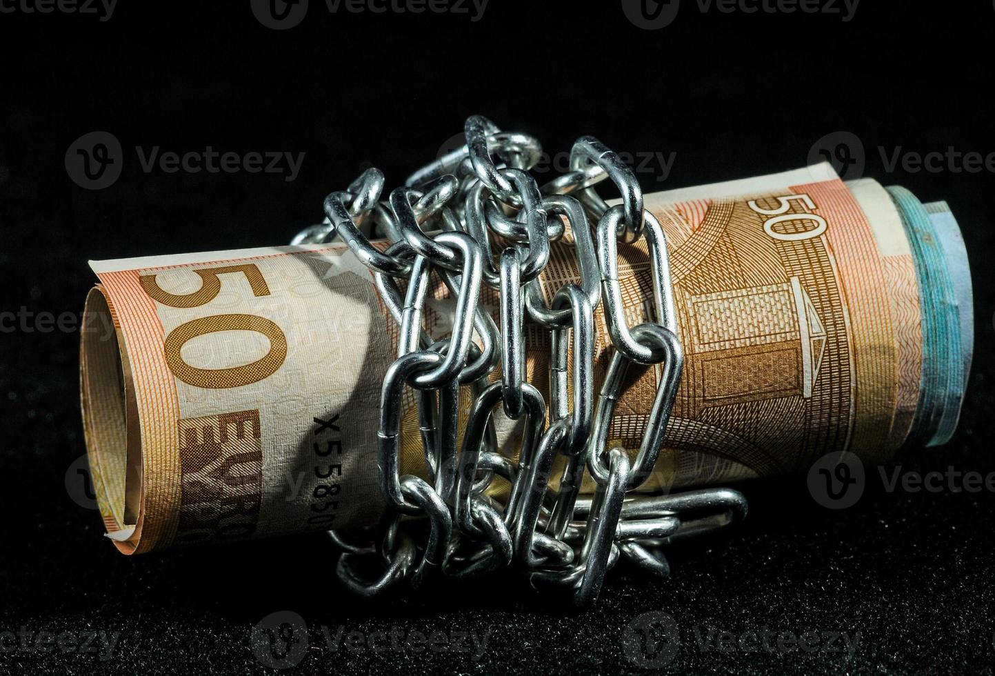 Money wrapped in chains photo