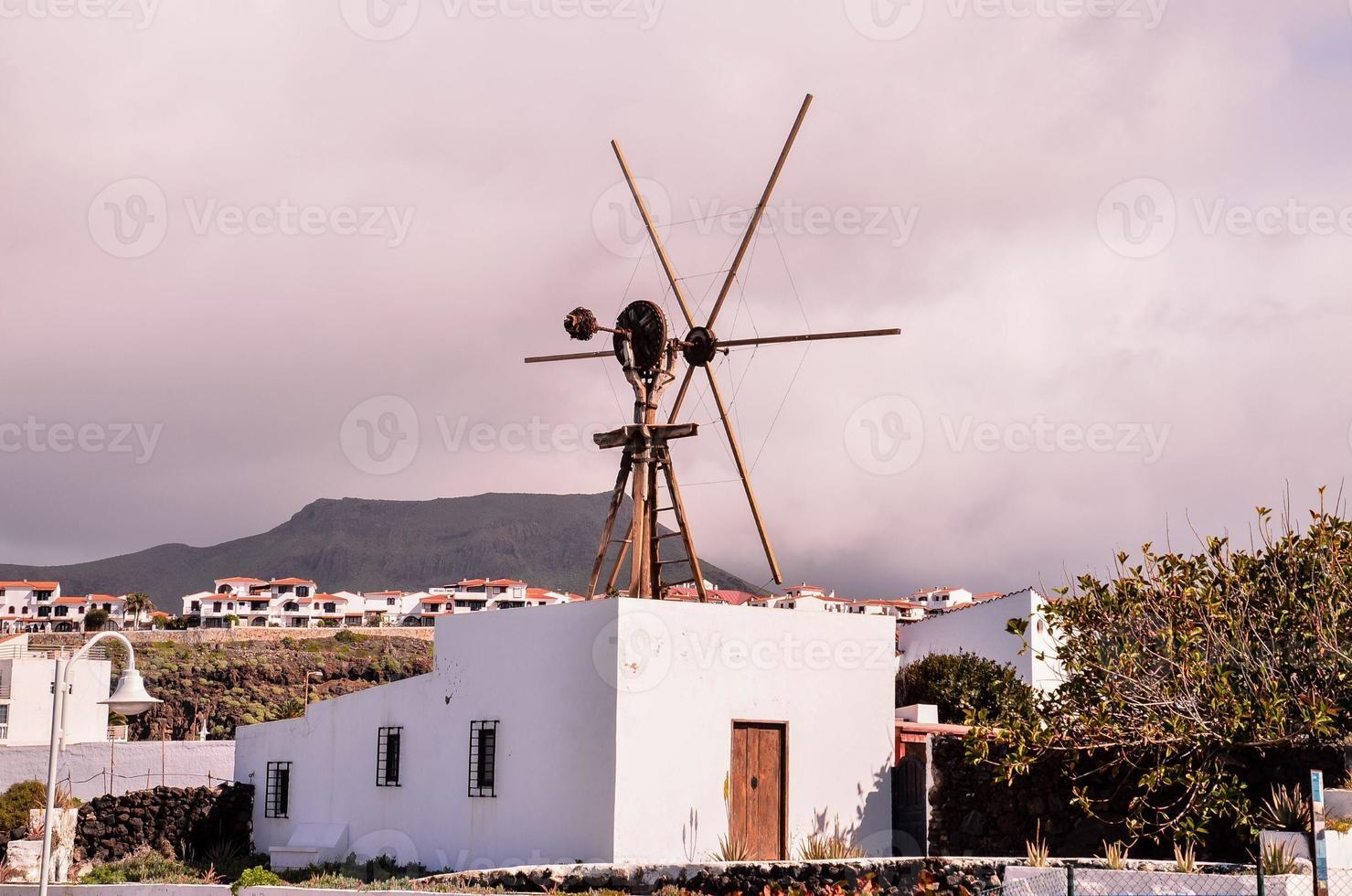 Small windmill on the rooftop photo