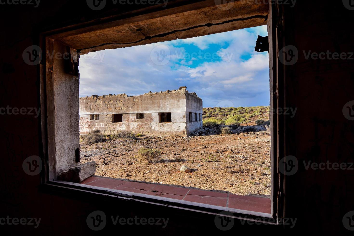 View through the window of an abandoned building photo