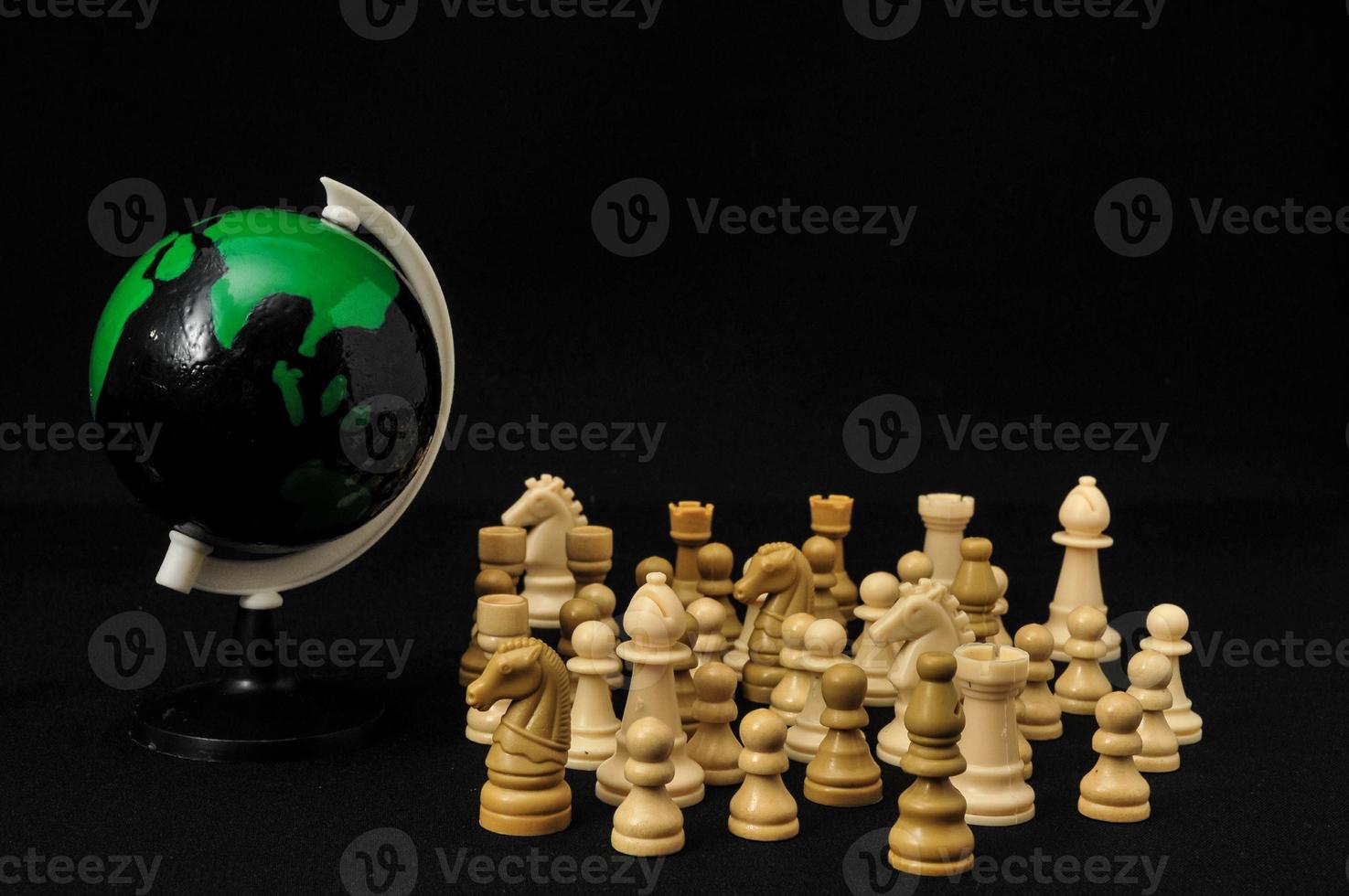 Chess figures and a green globe photo