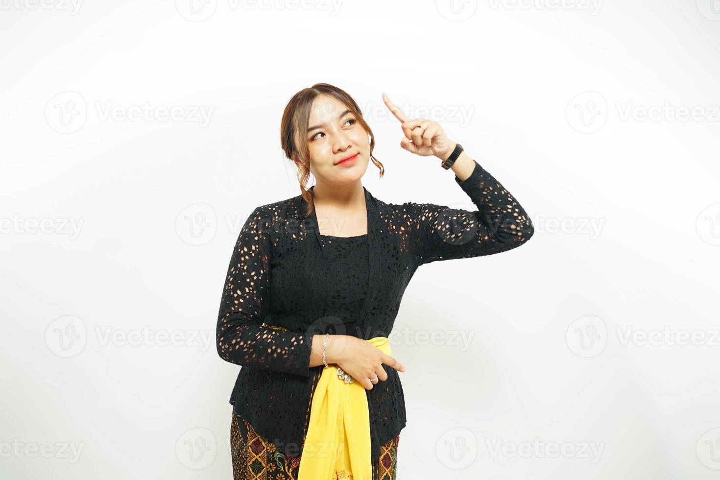 Balinese woman expresses her newfound idea with a pointed finger towards photo