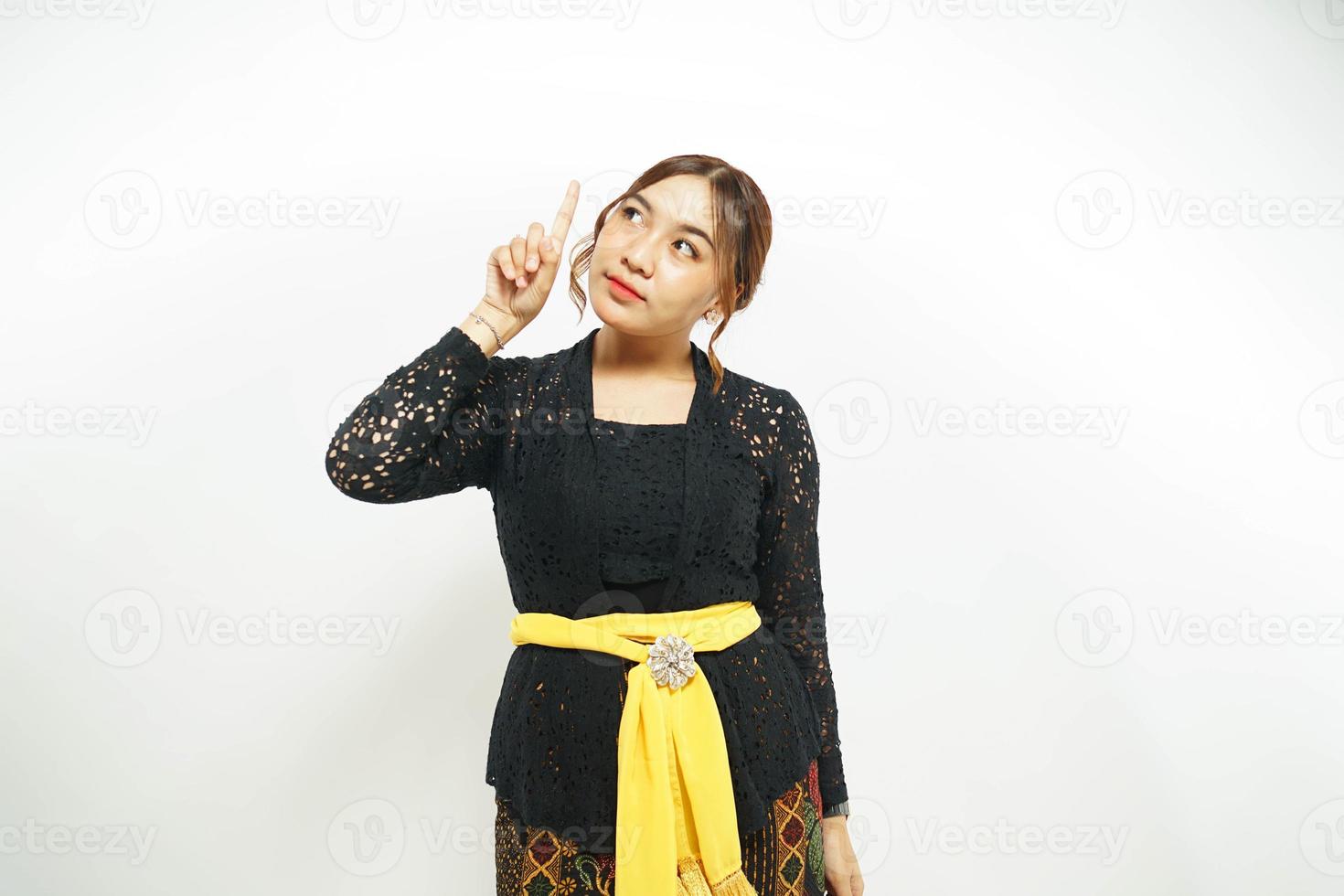 Balinese woman expresses her newfound idea with a pointed finger towards photo