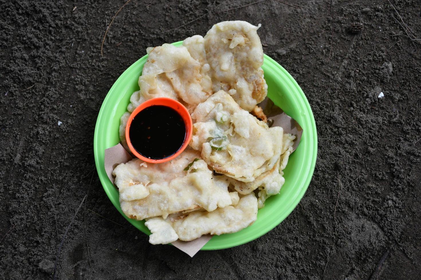 Fried tempeh is a traditional Indonesian food. Made from soybeans, tempeh is a  nutritious and flavorful ingredient that is widely used in a variety of Indonesian dishes. photo