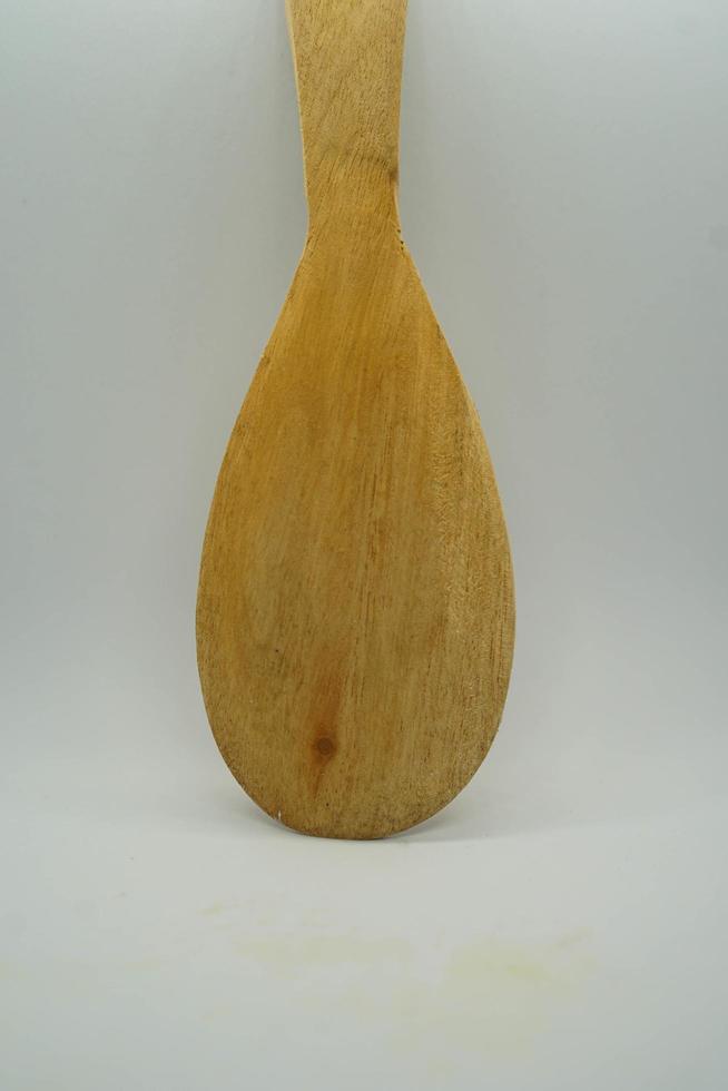 Wooden spoon used for serving rice photo