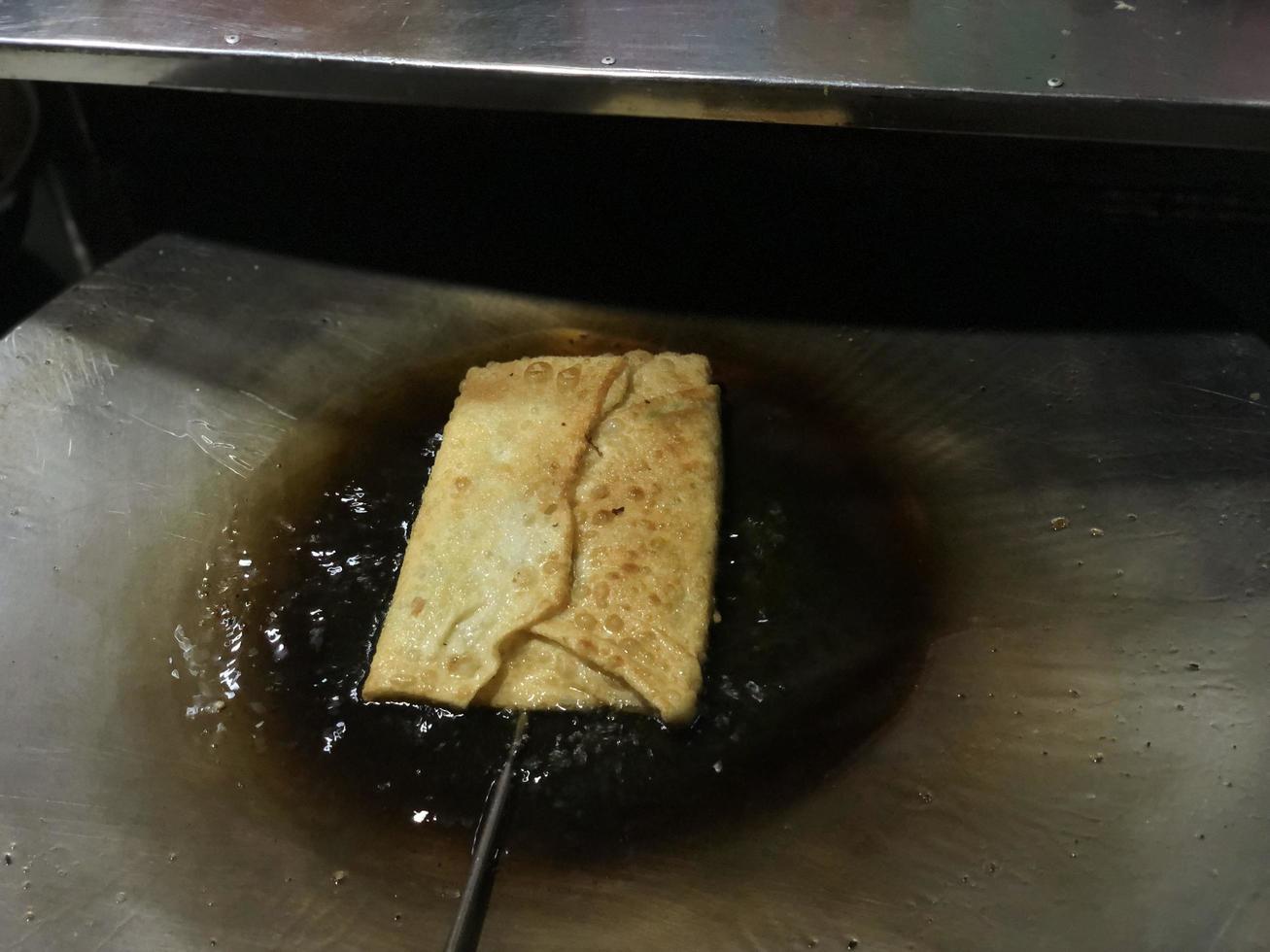 cooking Martabak a traditional Indonesian food. photo