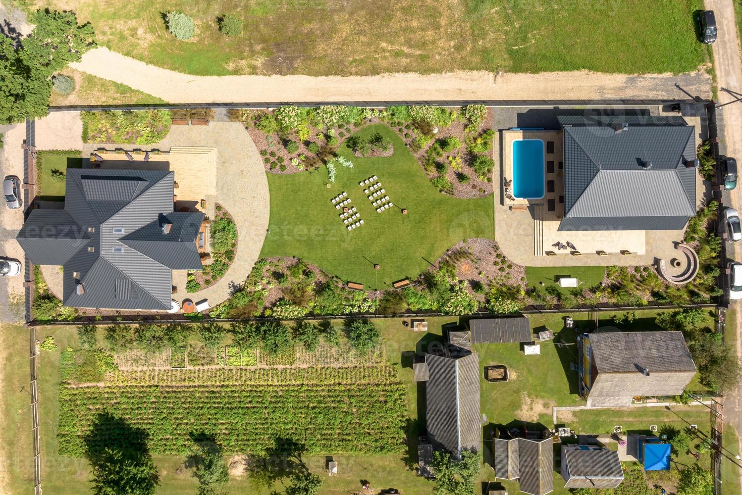 aerial panoramic view on wooden eco house or homestead in green village photo