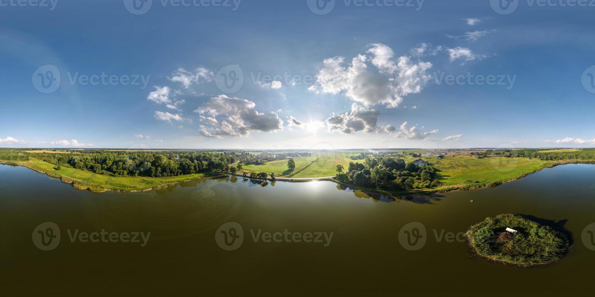 360 hdri panorama aerial view over lake with island in equirectangular seamless spherical projection with zenith and nadir,  ready for use as sky replacement in drone 360 panoramas or VR content photo
