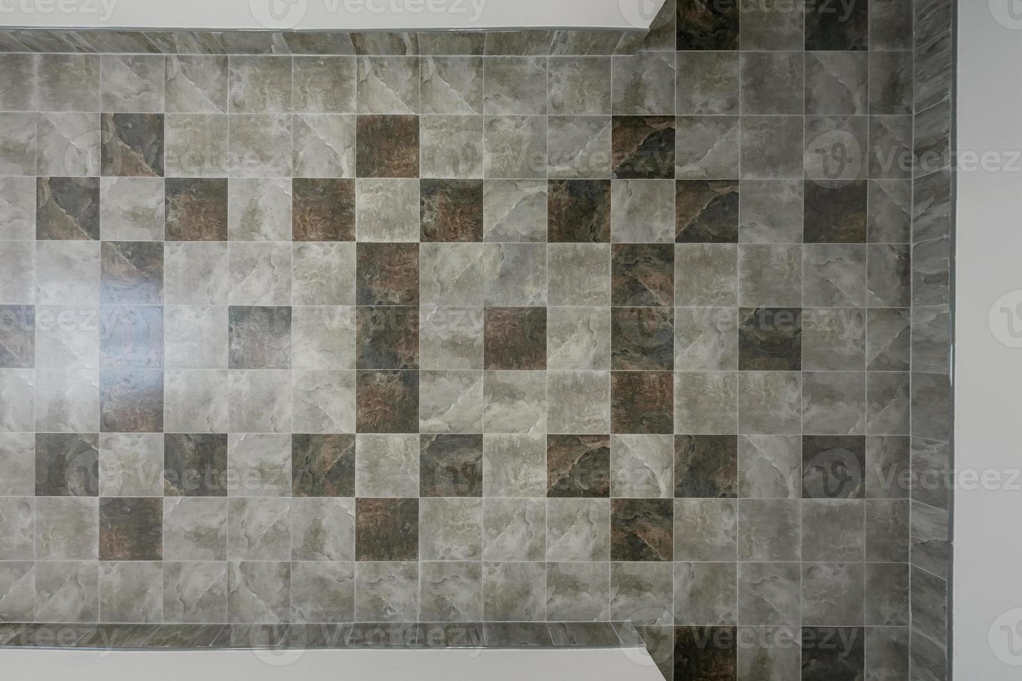 stone and ceramic floor tiles texture in corridor, view from above photo