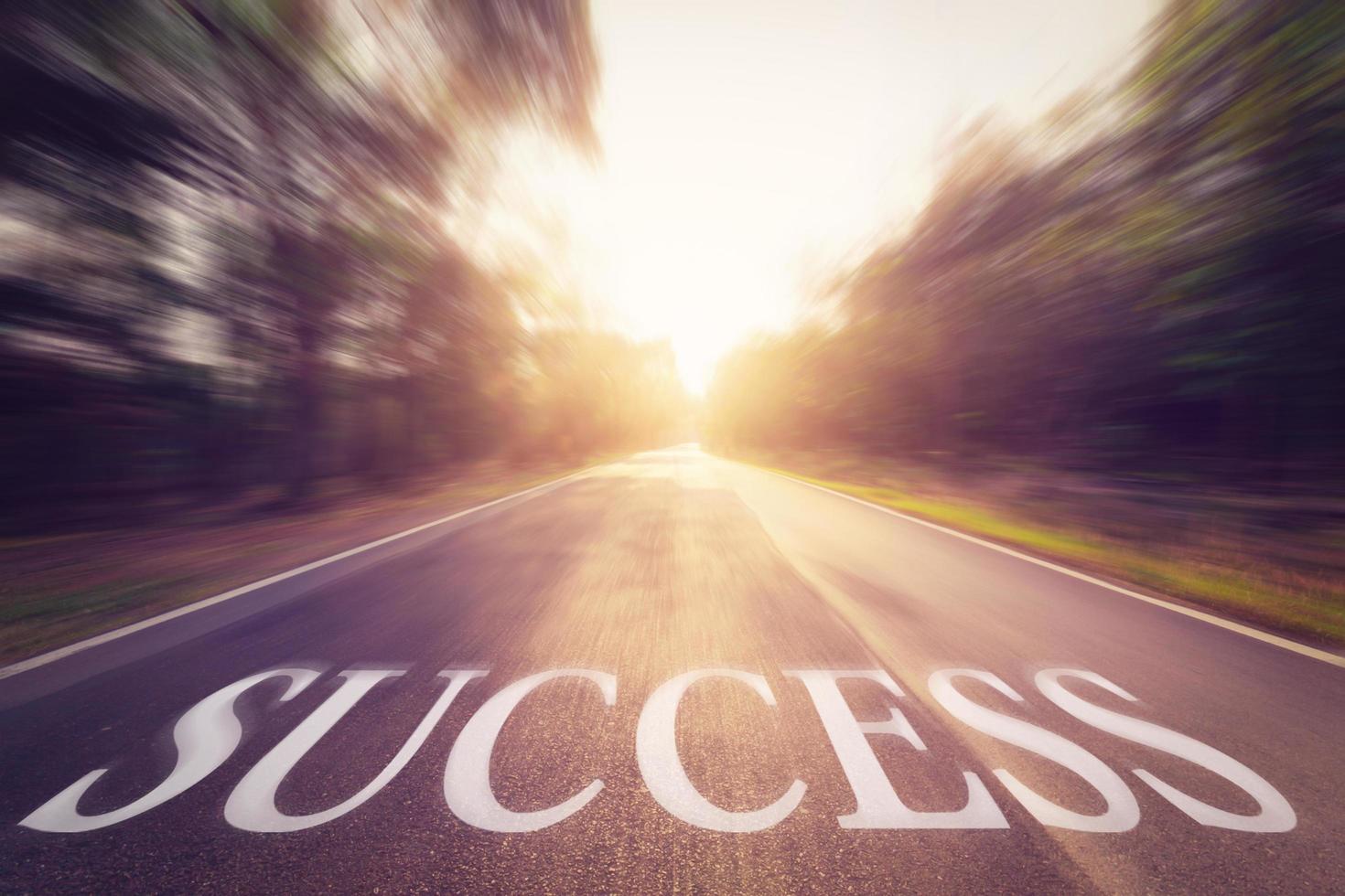 Empty blur asphalt road and sunlight and sign which symbol success. Concept for success. photo