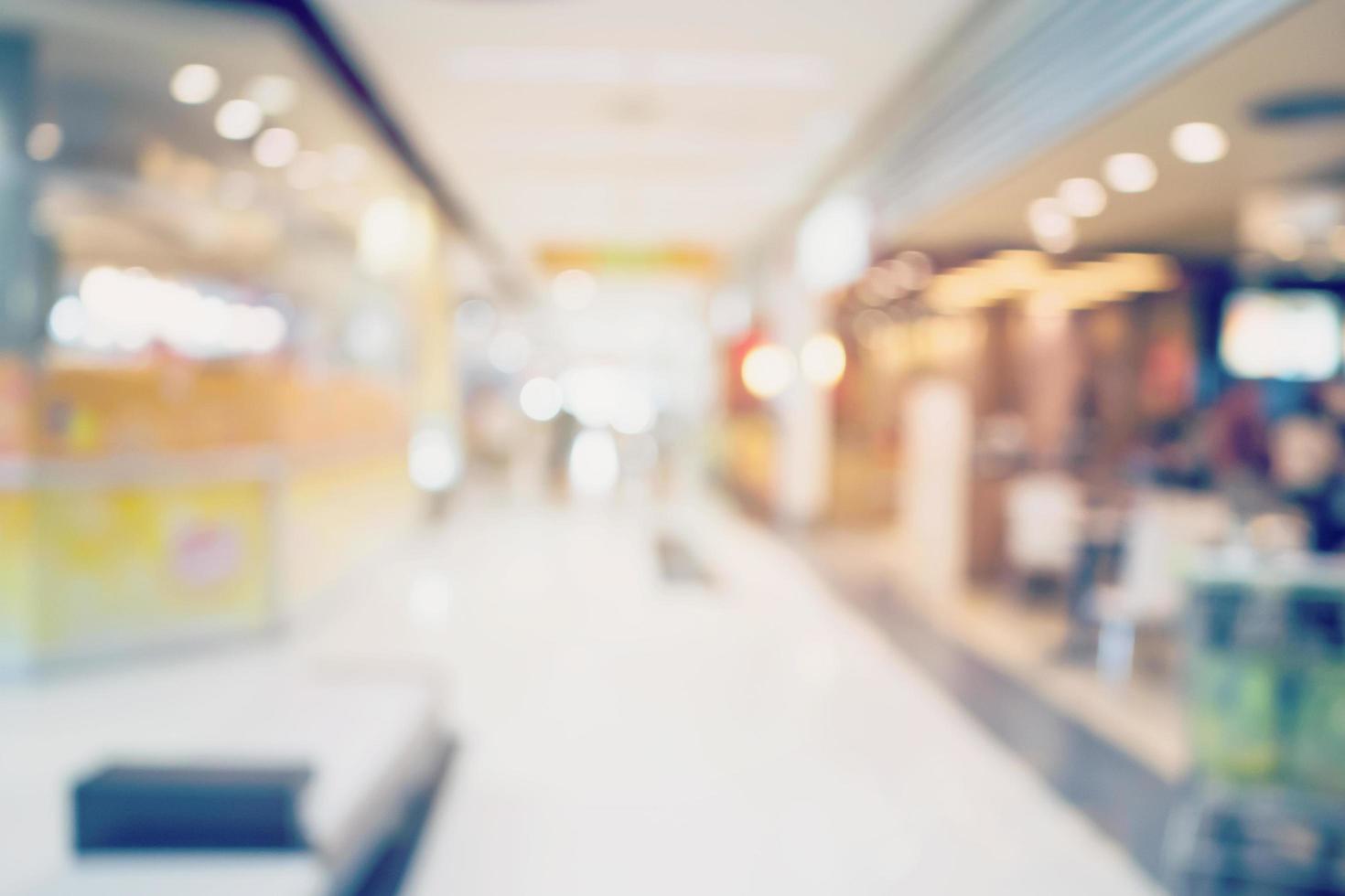 People shopping in department store. Defocused blur background. photo