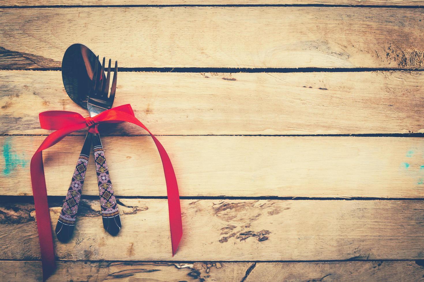 Valentines dinner on wooden background with space. Vintage style. photo