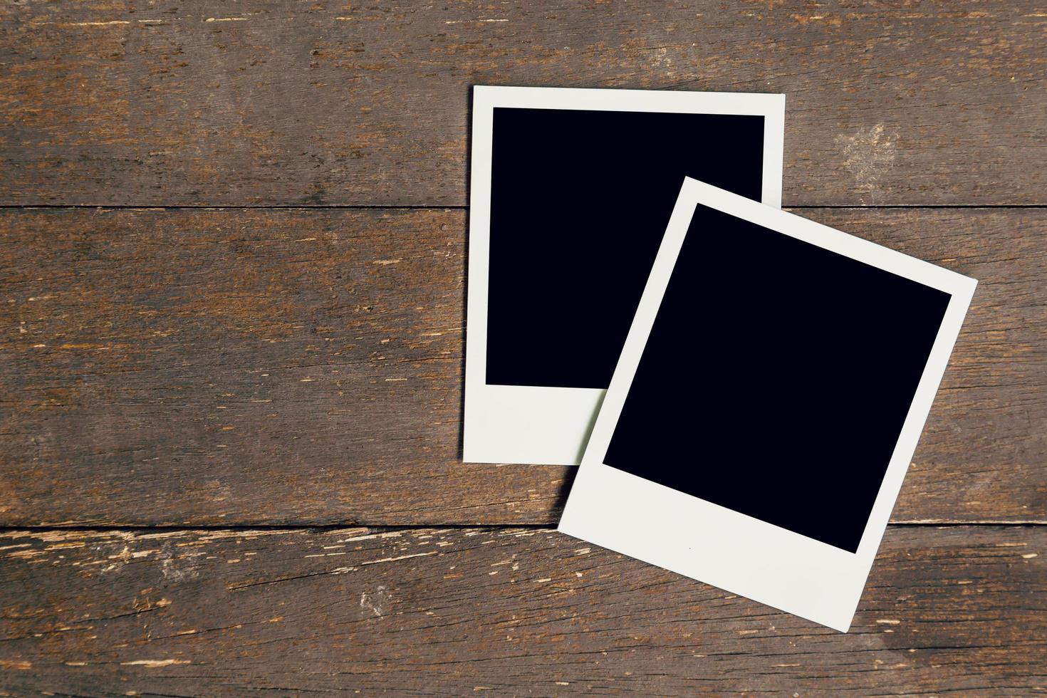 Vintage photo frame blank on old wood background with space