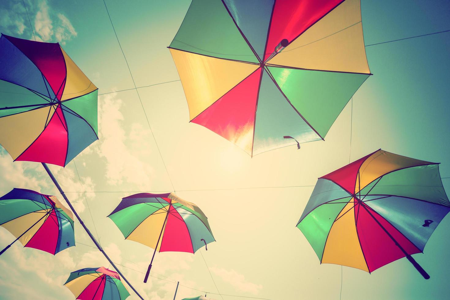 Colorful umbrella street decoration with sunlight. Vintage tone. photo