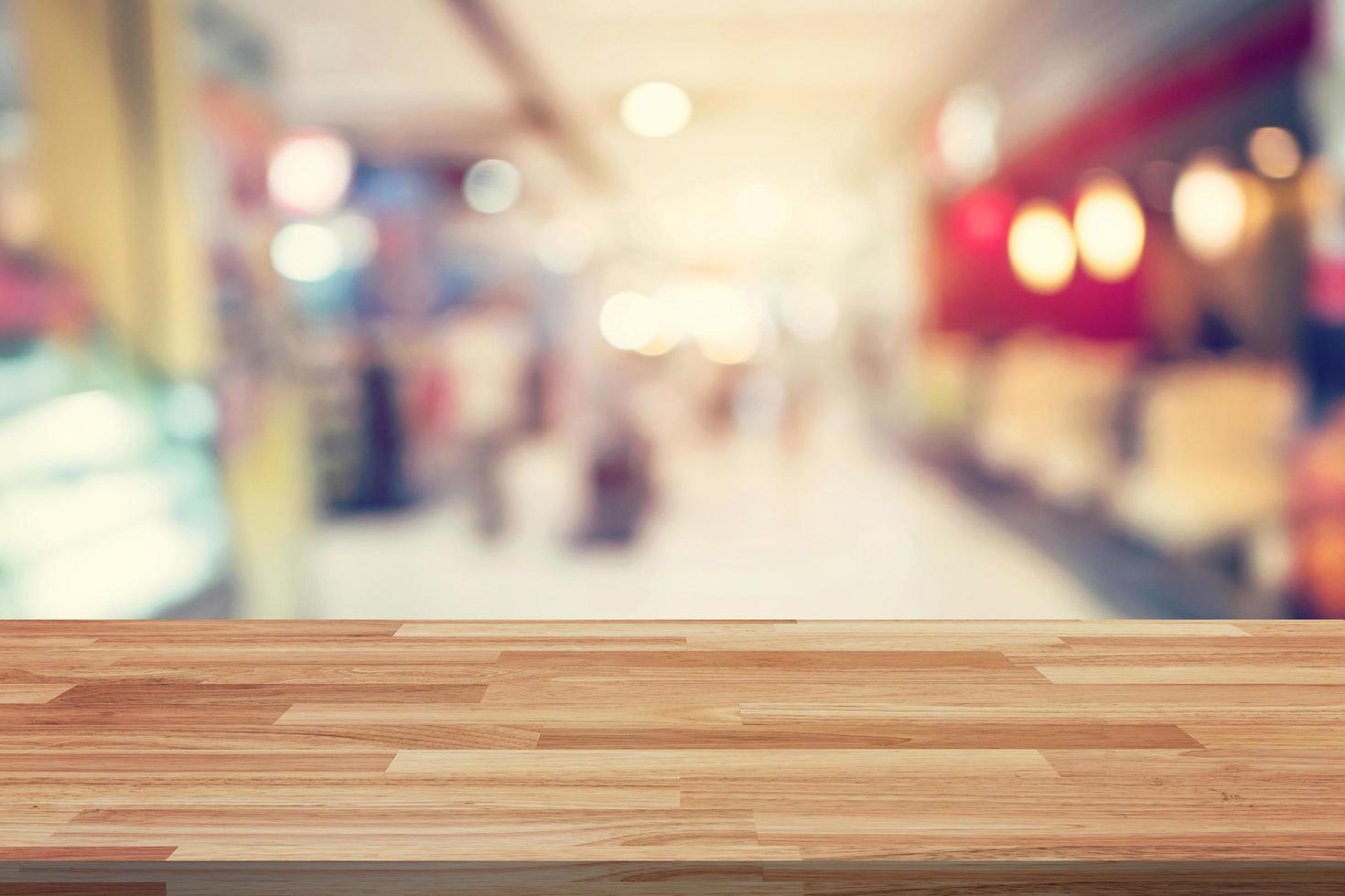 Empty wood table and Blurred background display montage for advertising and product at shopping in department store. Defocused blur background. photo