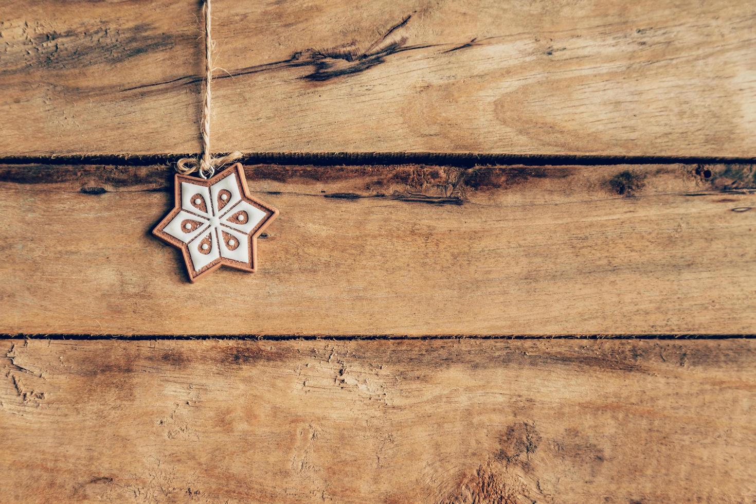 Christmas decoration hanging on wood background texture with copy space. photo