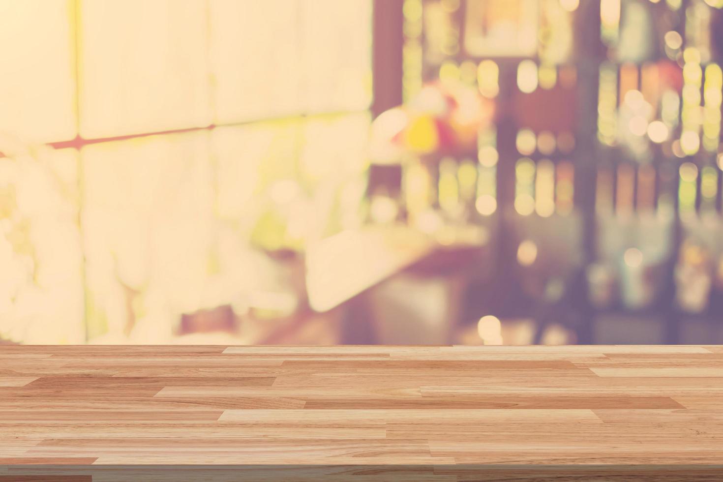 Empty wood table and Blurred background display at coffee shop with space for product. photo