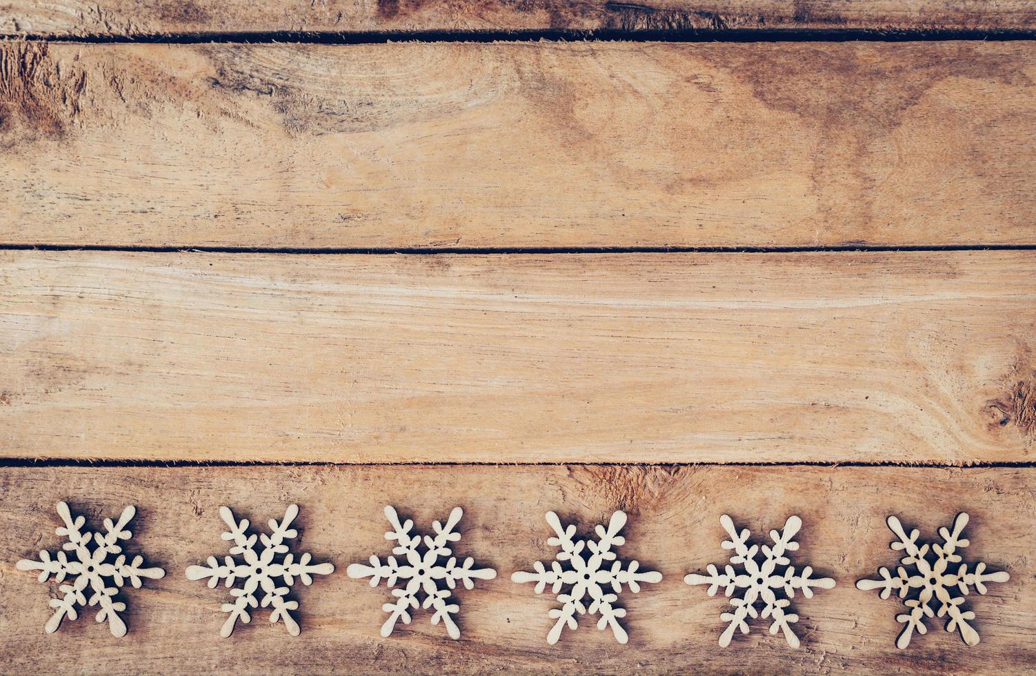 Christmas decoration with wood snowflake on table with copy space photo