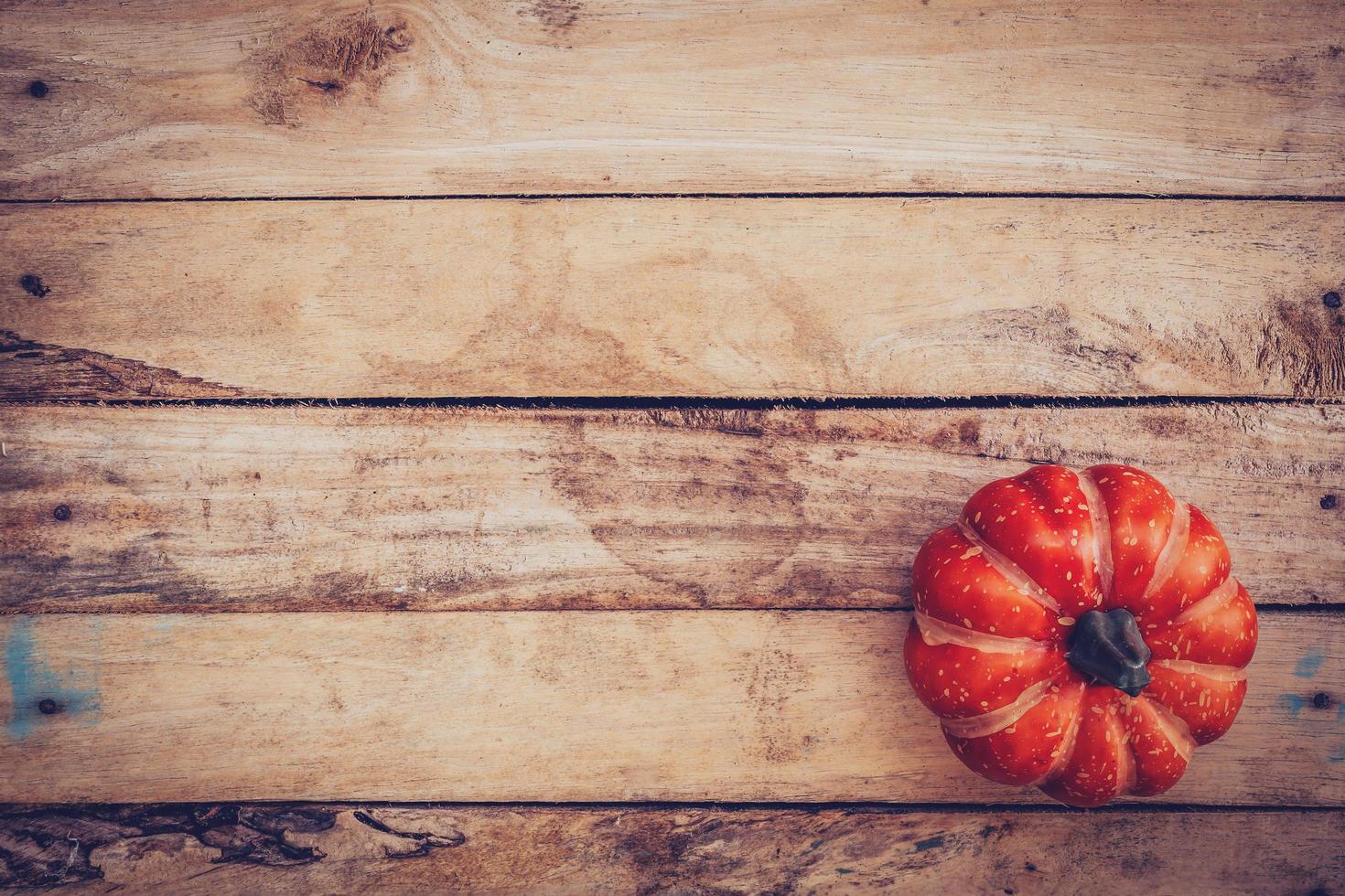 autumn background with pumpkin on wooden board with space, Vintage filter. photo