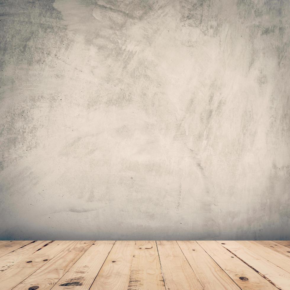 empty cement wall and wood floor background with space photo