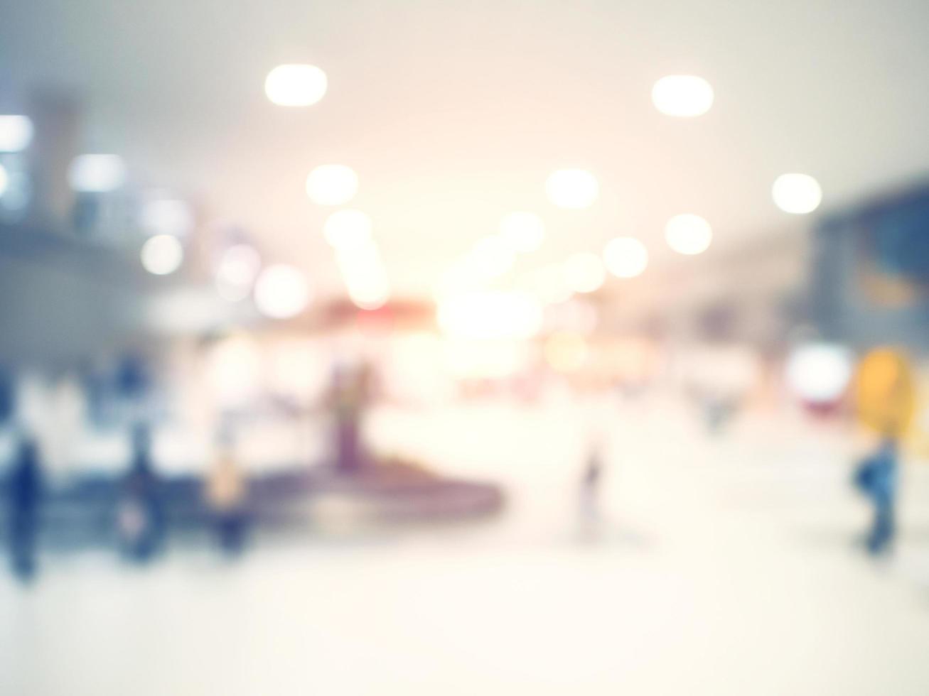 abstract blurred background  crowd people at terminal department at airport with bokeh light. photo