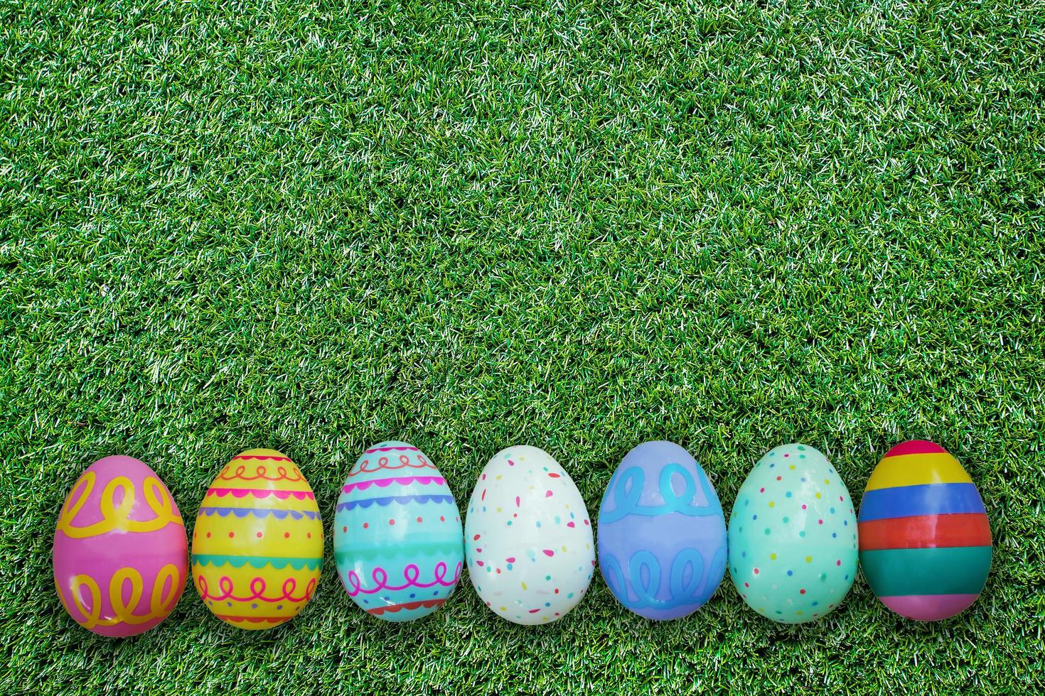 Easter egg on green grass texture and background photo