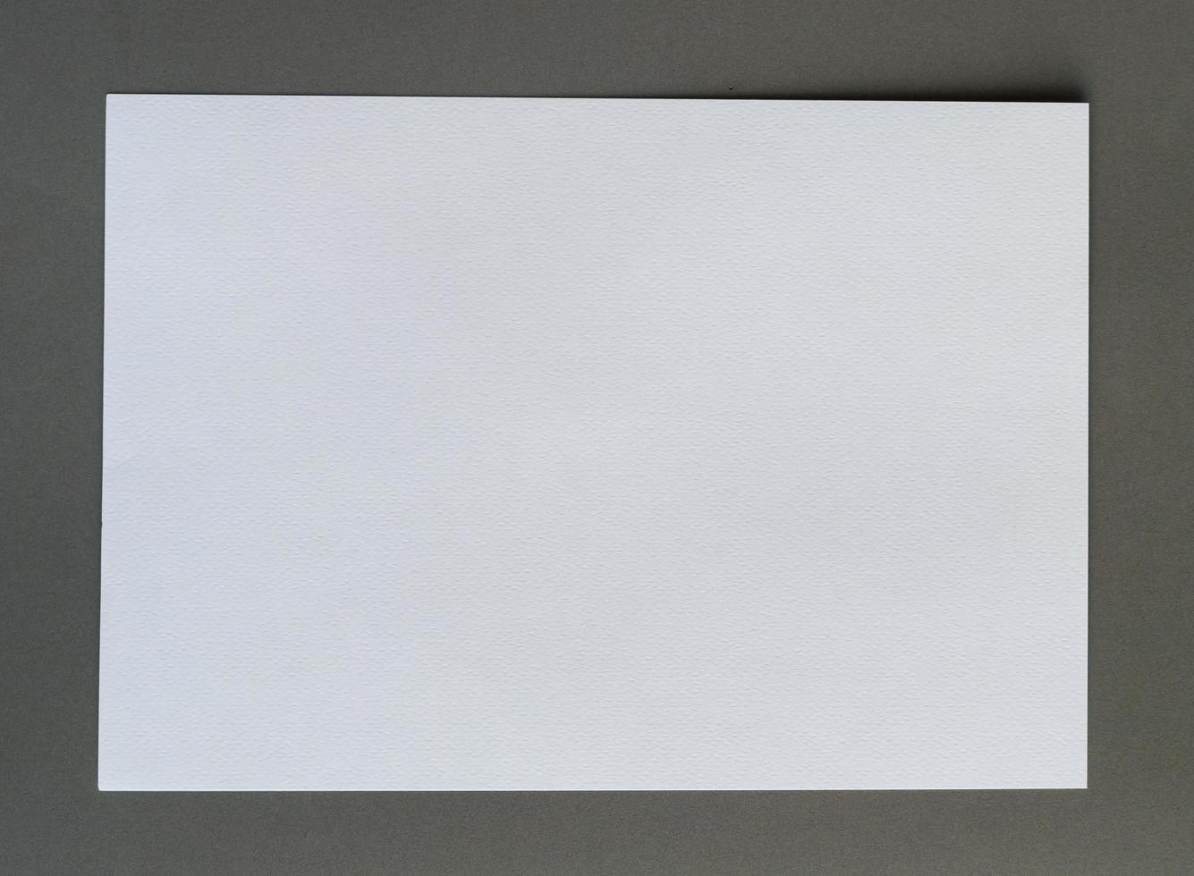 White crumpled paper on gray background horizonta photo