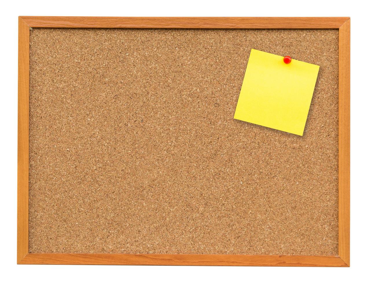 Yellow blank note on Cork board on isolated white with clipping path. photo