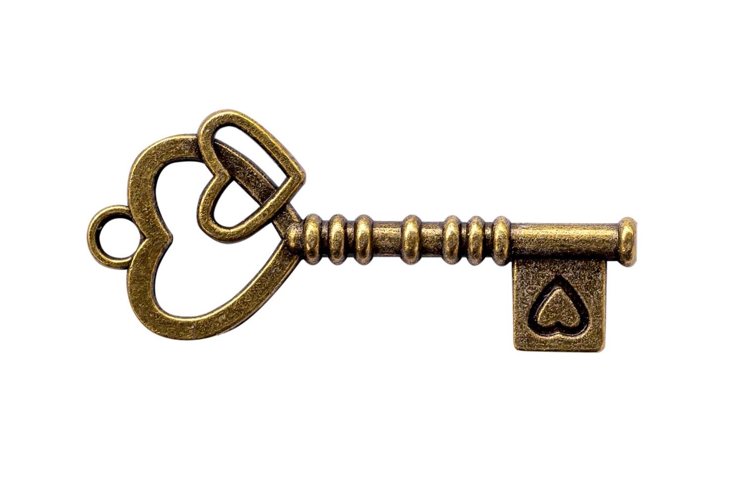 key vintage and heart shape on isolate with clipping path. photo