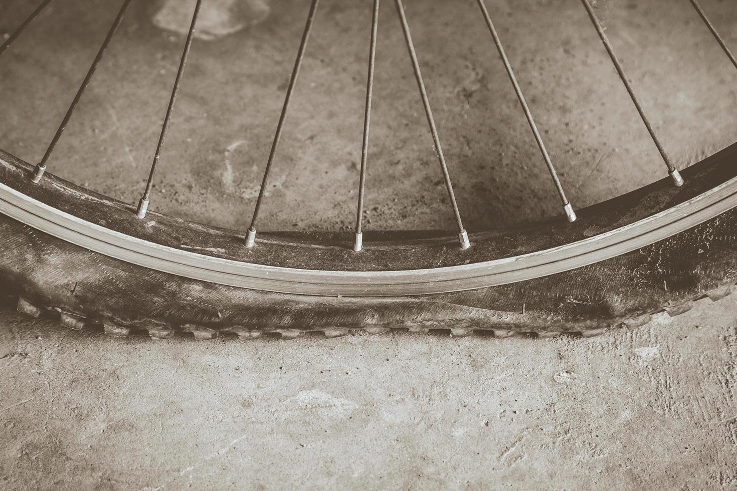 flat tire on dirt road with sepie tone photo