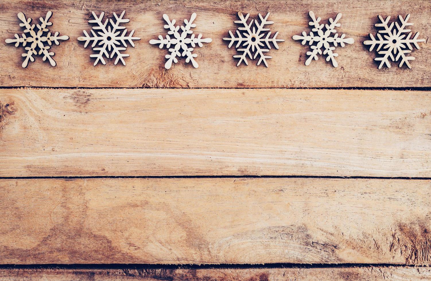 Christmas decoration with wood snowflake on table with copy space photo