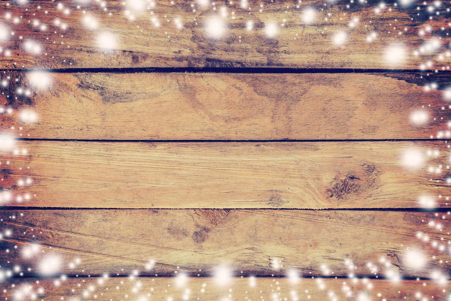 Above snow on wood board background and texture with space for text. photo