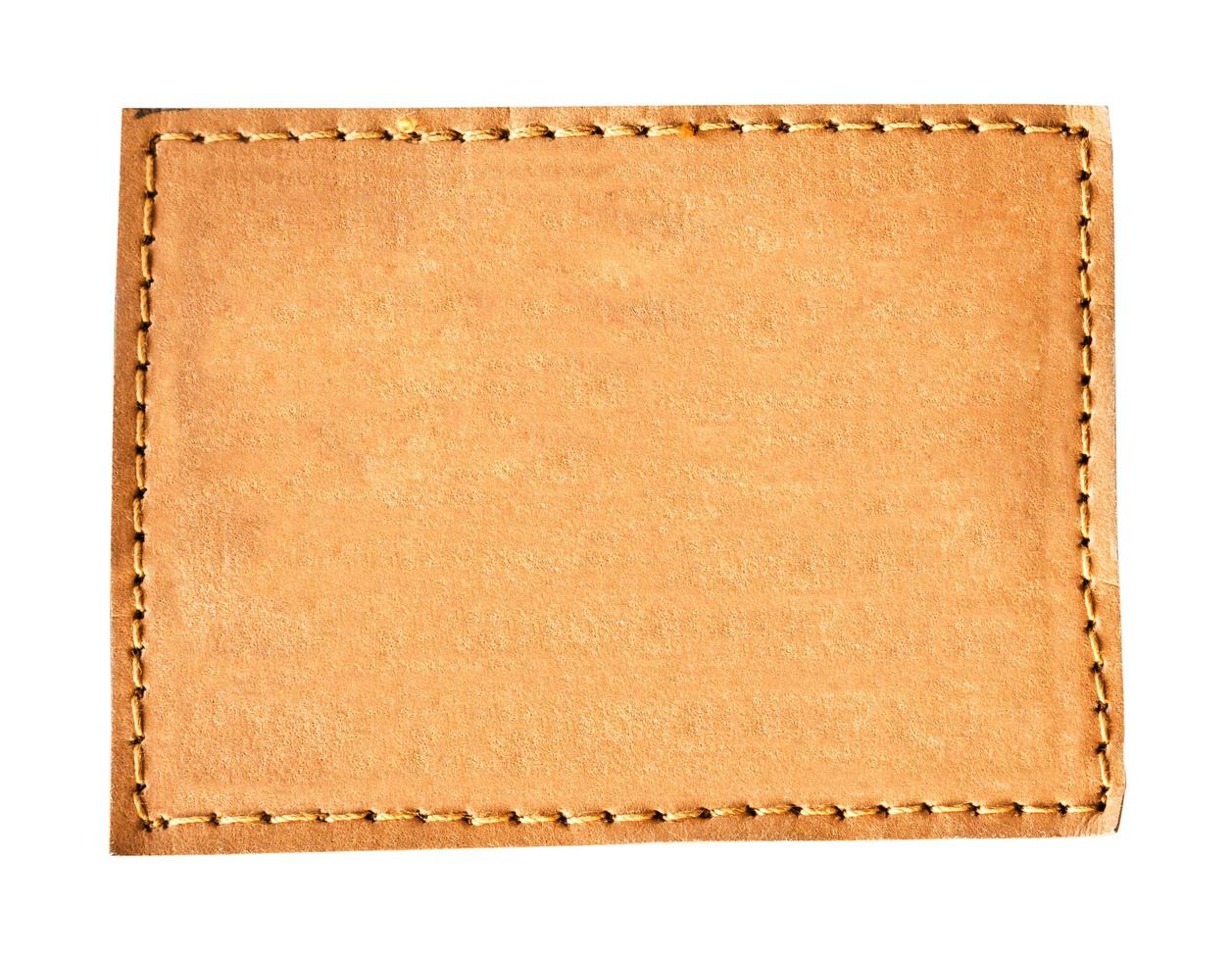 close up brown leather jeans empty on isolated white with space photo