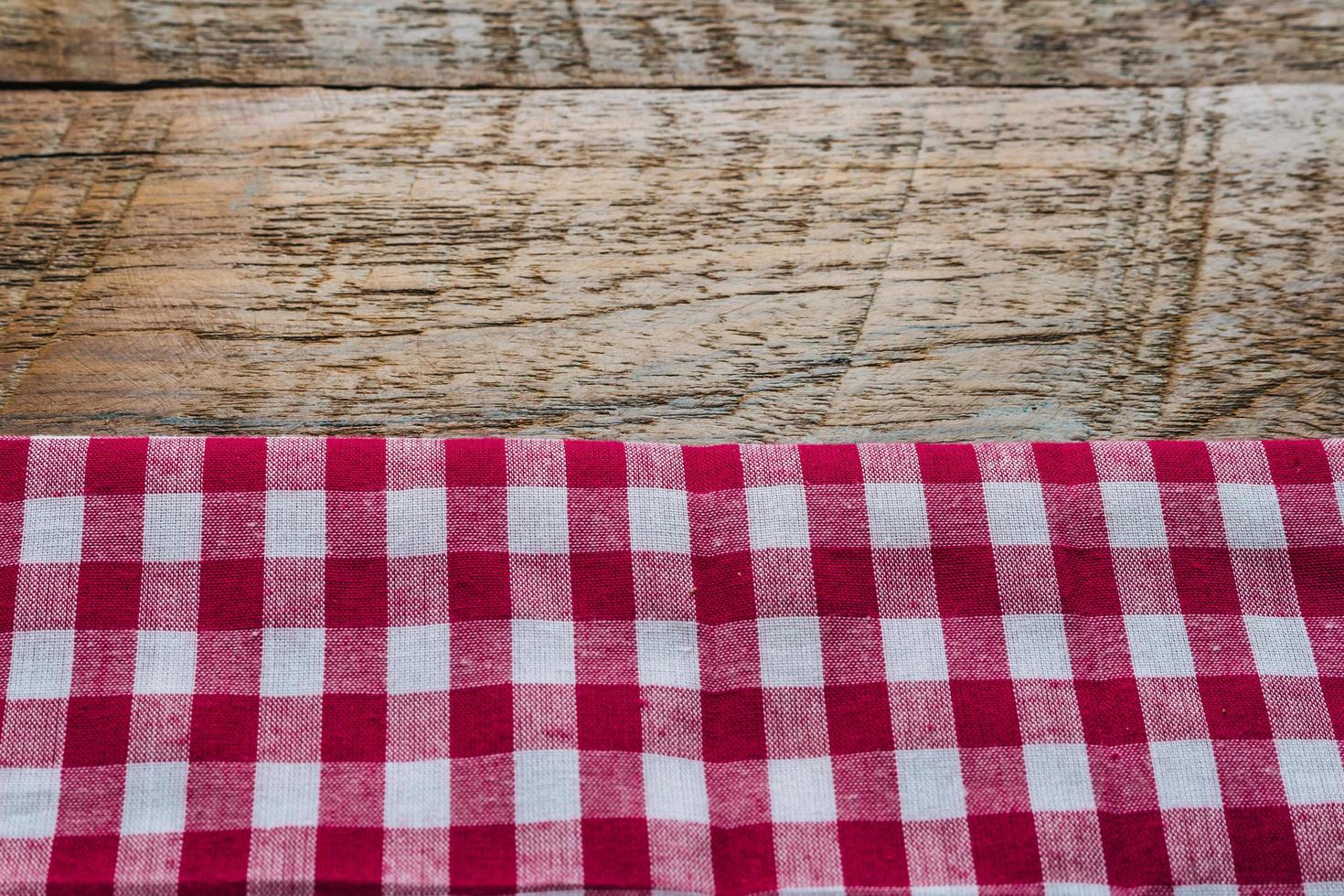 red fabric tablecloth textile on wooden background photo