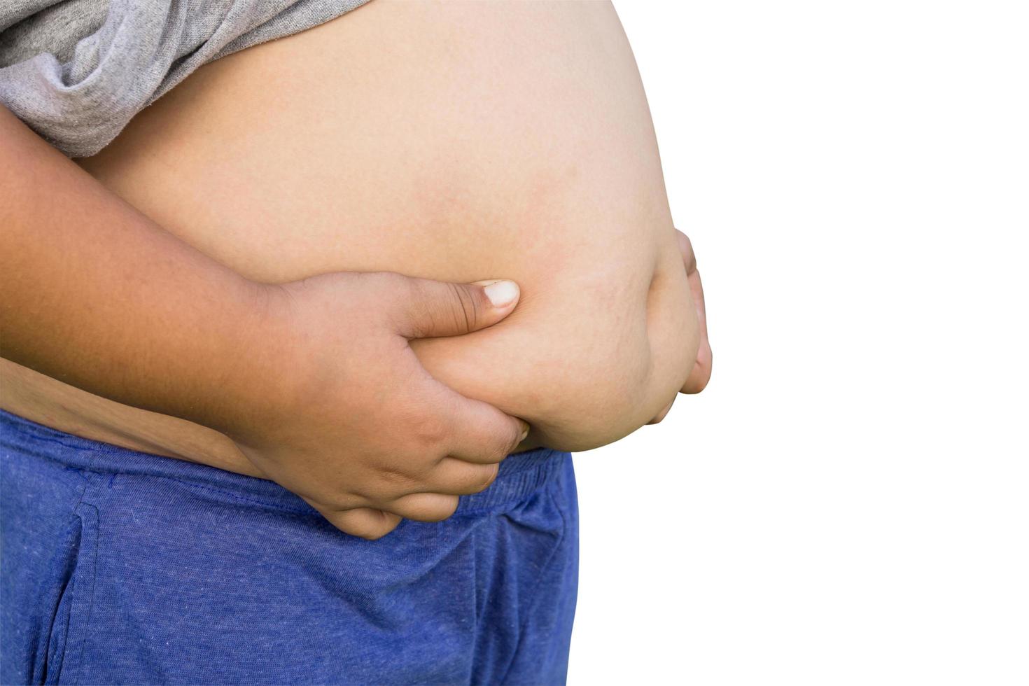Boy fat and unhealthy on isolated white with clipping path. photo