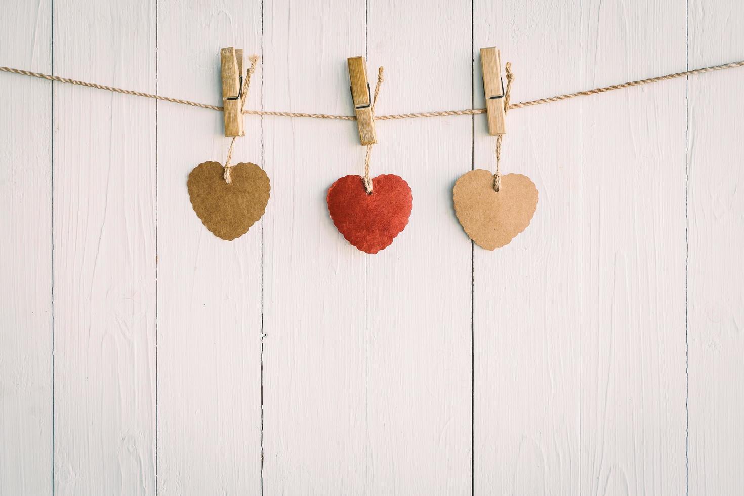 Heart on white wooden background with Vintage style. photo