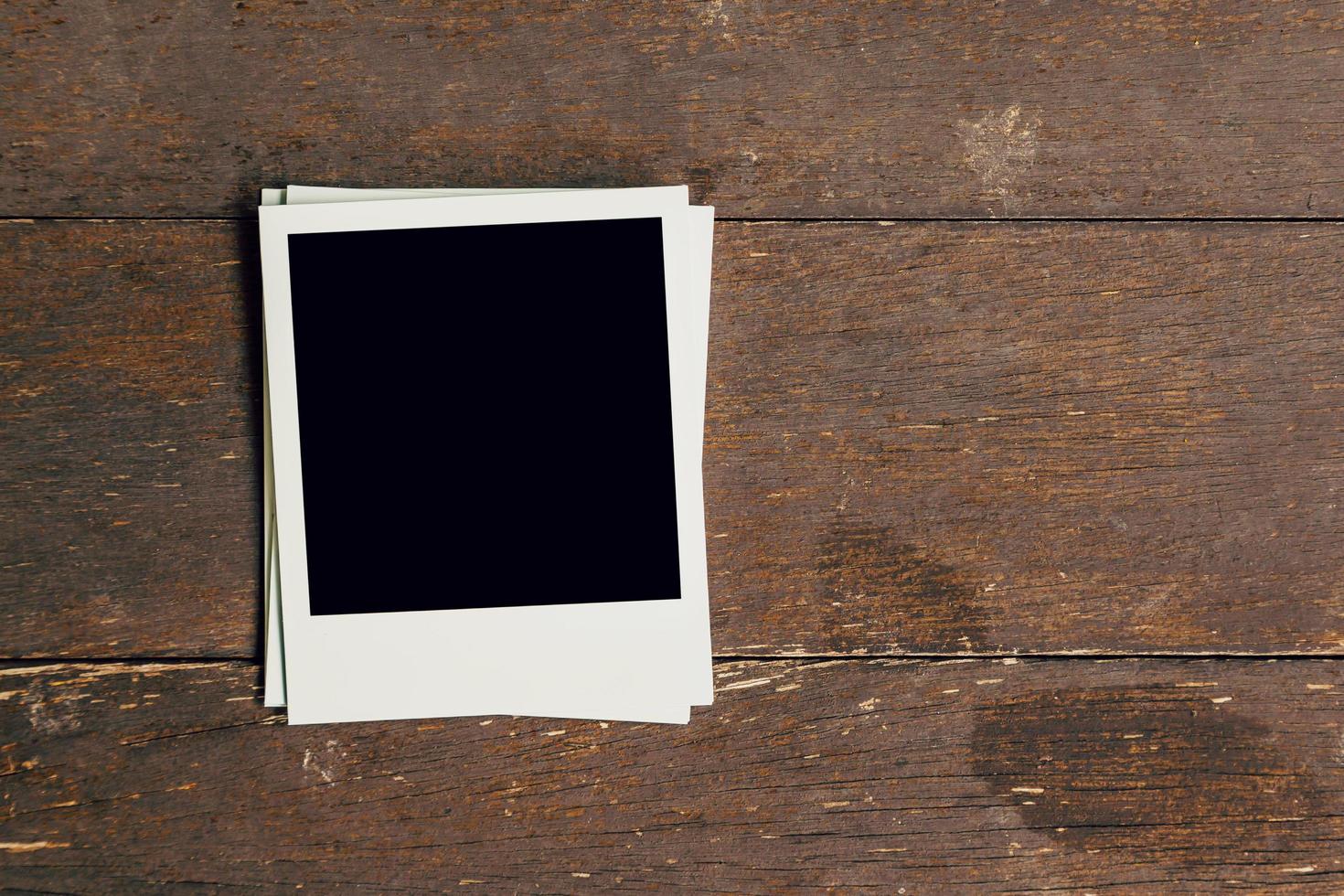 Three vintage frame photo blank on old wood background with space