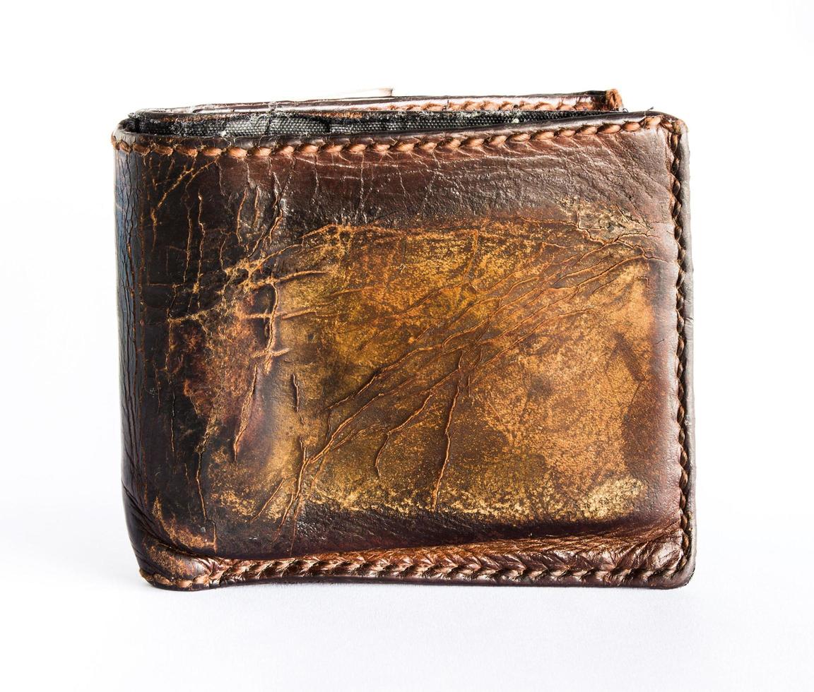 old leather pocket money on isolated white background photo