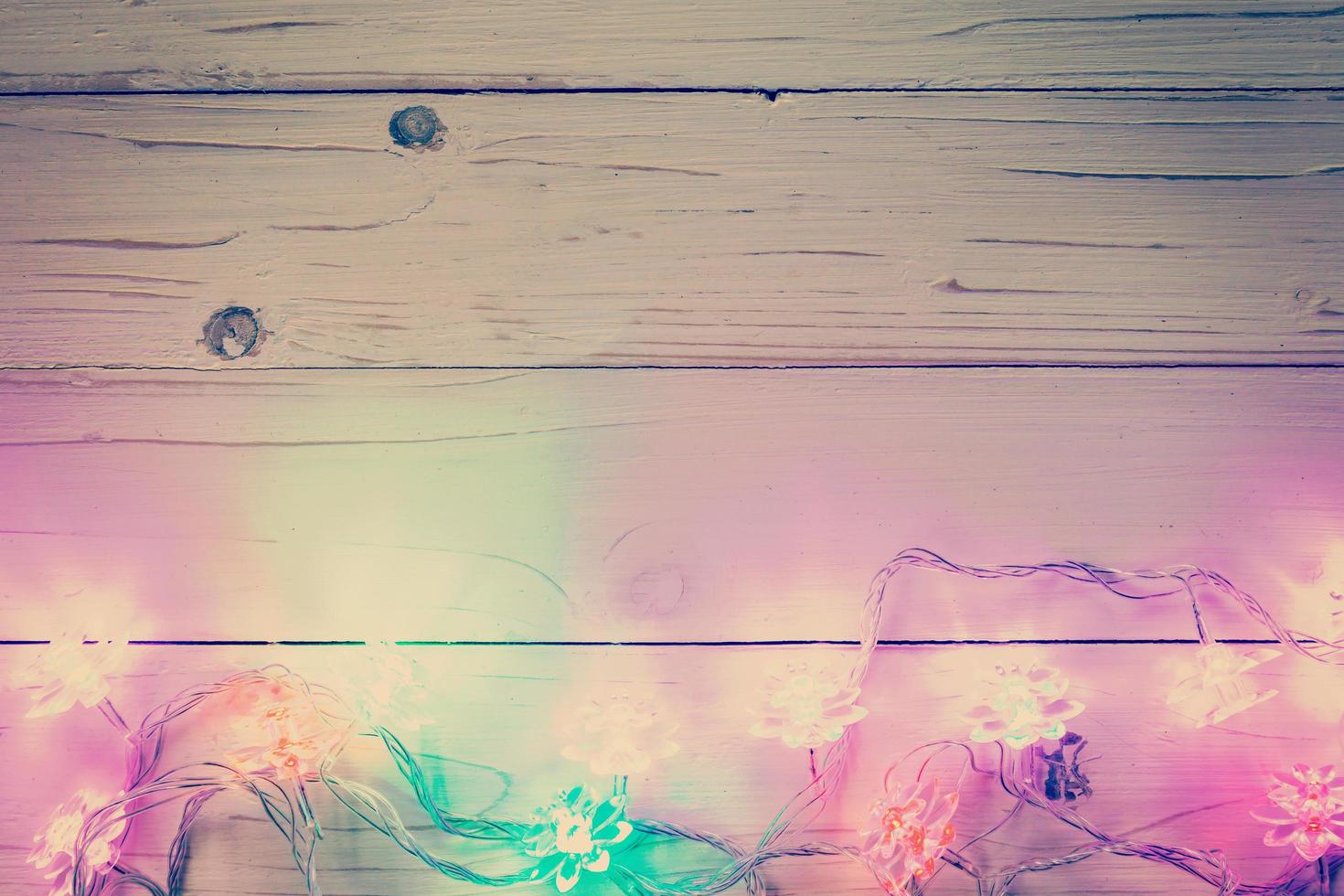 christmas light and christmas decoration on wood background with copy space. photo