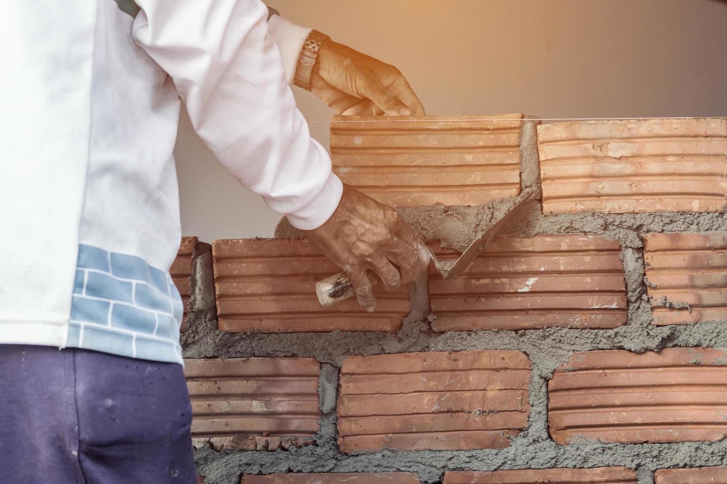 bricklayer man working build for construction photo